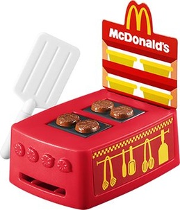 【パティグリル マシーン】マクドナルドのグリルをイメージしたおもちゃです。フライ返しを差し込むと、パティ(お肉)がひっくりかえり、焼きあがったように見えます。